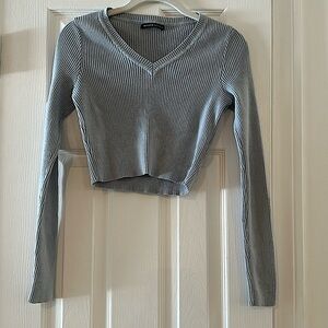 Brandy Melville, light blue super soft sweater. Crop top long sleeve V-neck.